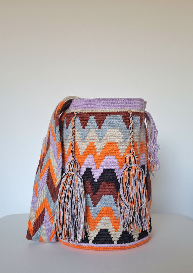 Authentic handmade Colombian Wayuu Mochila in different soft tones, cotton threads, geometric design. Ethically and responsibly sourced.