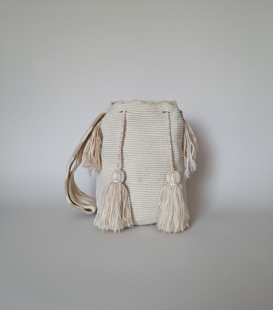 Authentic handmade Colombian Wayuu Mochila in vibrant light beige threads. Large artisanal bag is traditionally crafted; adds a tribal touch to boho fits.