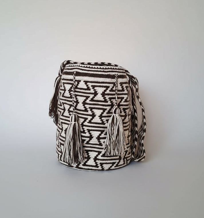Authentic handmade Colombian Wayuu Mochila in vibrant cotton threads, with Geometric Design in Black and White. Large bag is traditionally crafted; adds a tribal touch to boho fits.