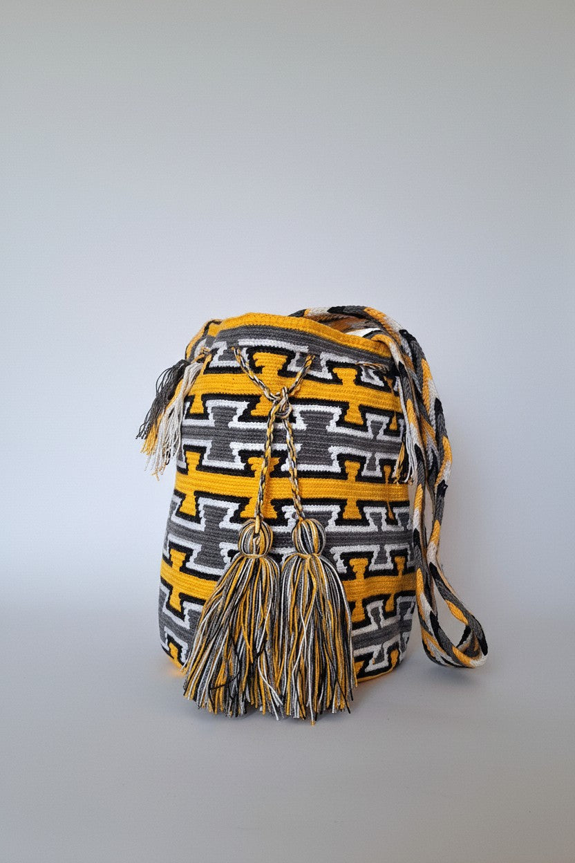 Authentic handmade Colombian Wayuu Mochila in yellow and grey cotton threads, geometric design. Ethically and responsibly sourced.