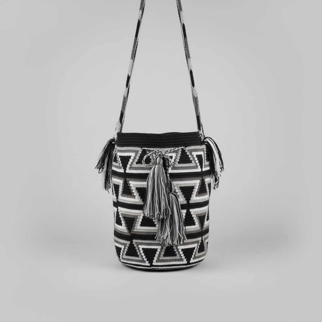 Authentic handmade Colombian Wayuu Mochila in vibrant cotton threads, geometric design black and white. Ethically and responsibly sourced.