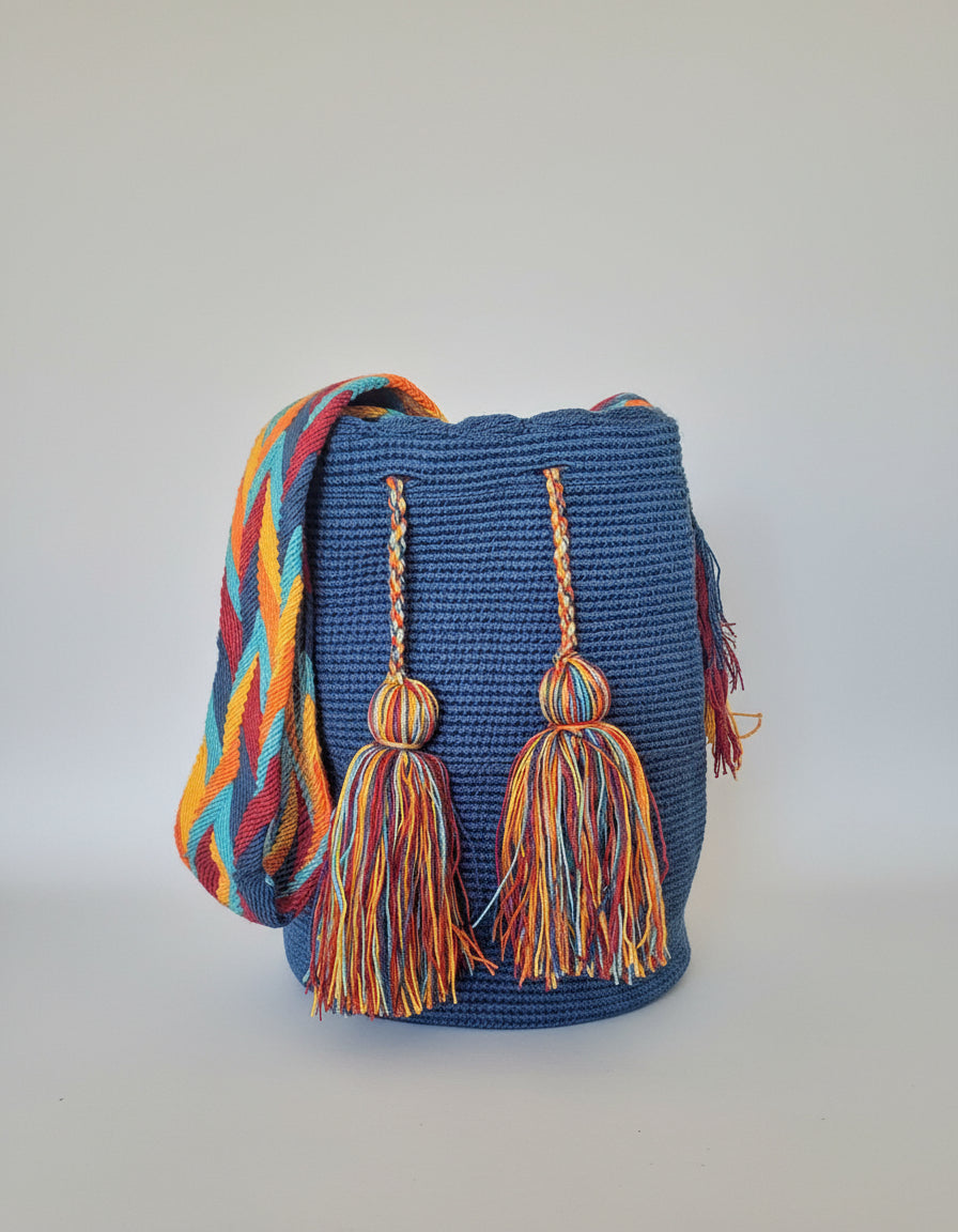 Authentic handmade Colombian Wayuu Mochila in navy blue threads, artisan-made and perfect for boho styling.