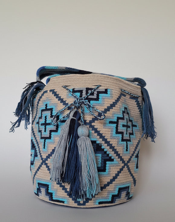 Detailed view of traditional Wayuu crochet technique and tassels on a mochila bag. Ethically and responsibly sourced.