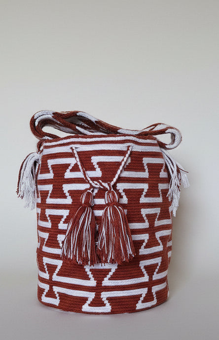 Authentic handmade Colombian Wayuu Mochila in vibrant cotton threads, geometric design. Ethically and responsibly sourced.