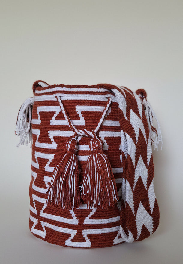 Detailed view of traditional Wayuu crochet technique and tassels on a mochila bag. Ethically and responsibly sourced.