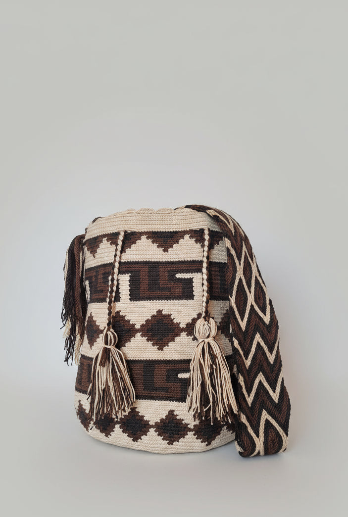Authentic handmade Colombian Wayuu Mochila in earthy cotton threads, geometric design. Ethically and responsibly sourced.
