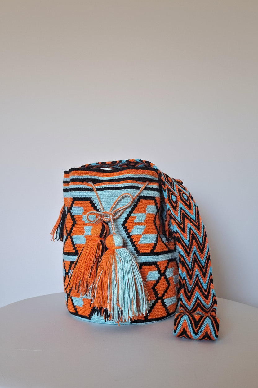 Authentic handwoven Colombian Wayuu Mochila in vibrant cotton threads, geometric design. Ethically and responsibly sourced.