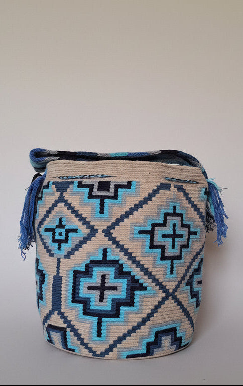 Detailed view of traditional Wayuu crochet technique and tassels on a mochila bag. Ethically and responsibly sourced.