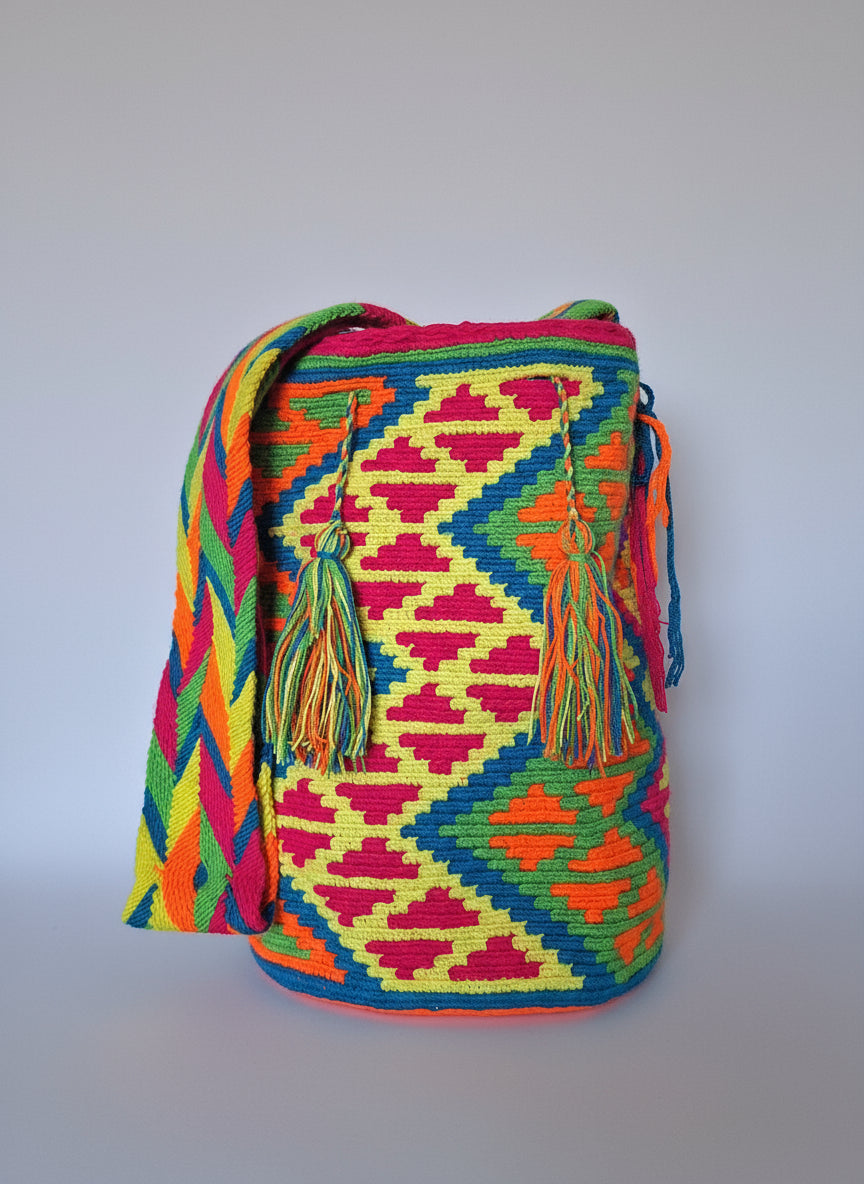 Authentic handmade Colombian Wayuu Mochila in bright colours cotton threads, and geometric design. Ethically and responsibly sourced.