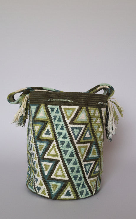 Authentic handmade Colombian Wayuu Mochila in vibrant cotton threads, geometric design in green and white. Rear view. Ethically and responsibly sourced.