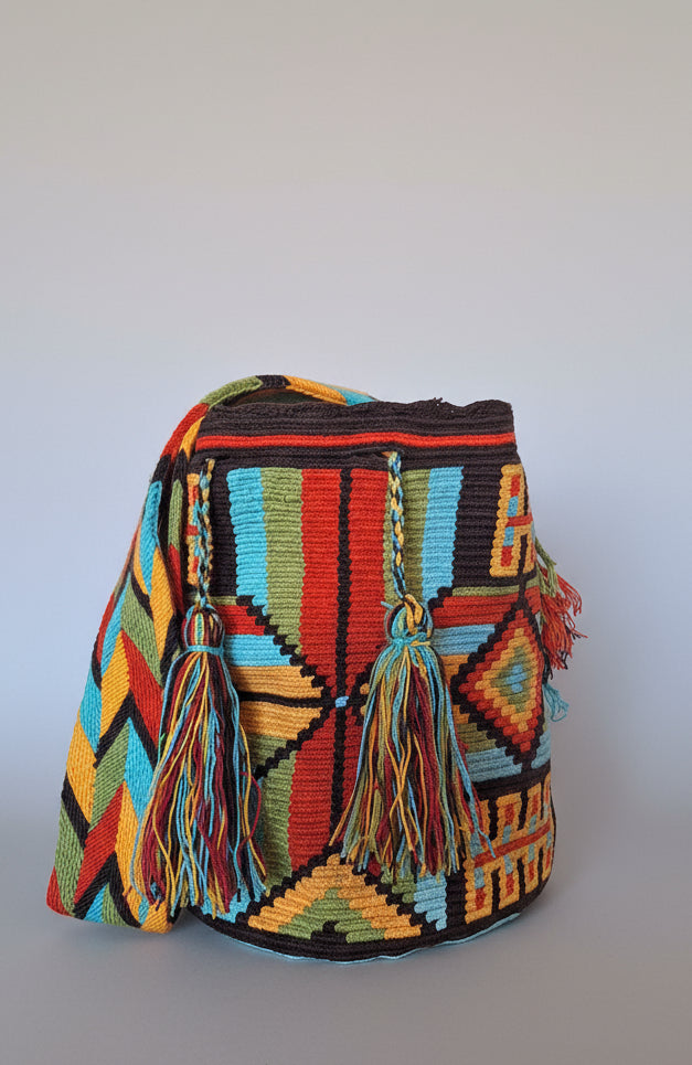 Authentic handmade Colombian Wayuu Mochila in vibrant coloured cotton threads, geometric design. Ethically and responsibly sourced.