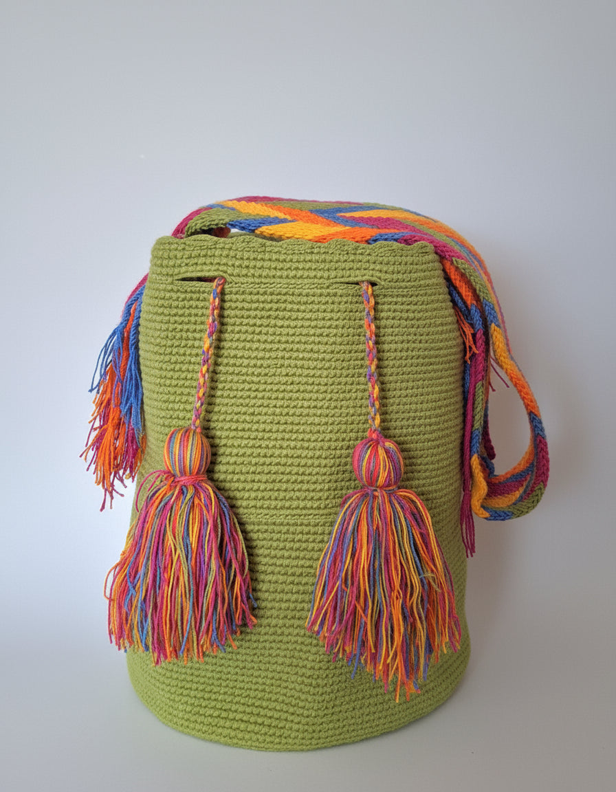 Authentic handmade Colombian Wayuu Mochila in vibrant green cotton threads. Large artisanal bag is hand-woven by artisans; great for boho-chic layers.