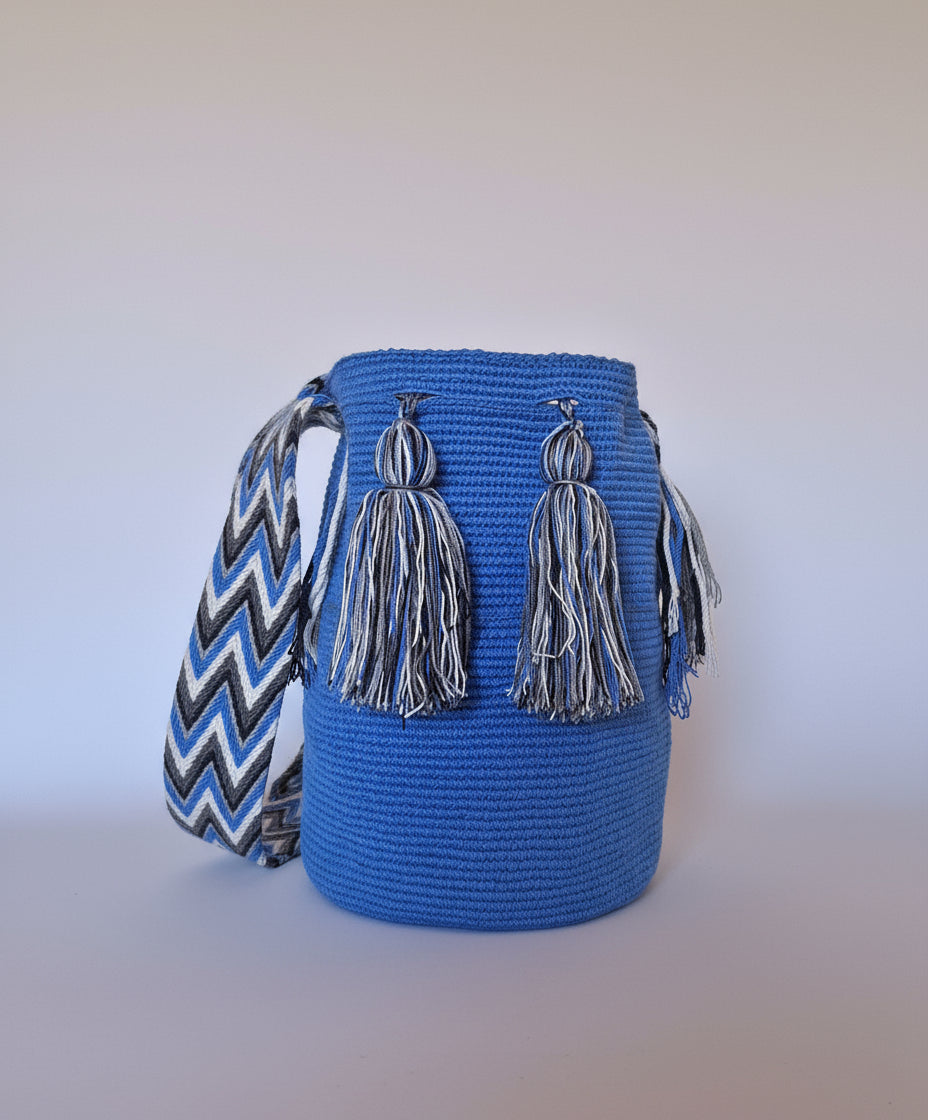 Authentic handmade Colombian Wayuu Mochila in vibrant electric blue cotton threads. Large artisanal bag is responsibly hand-crafted; a boho festival essential.