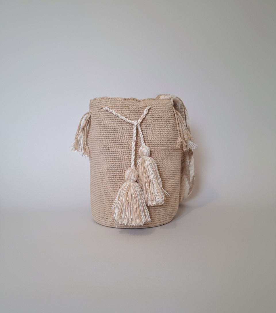 Authentic handmade Colombian Wayuu Mochila in fawn beige cotton threads. Item is fair trade bucket bag for a free-spirited look.