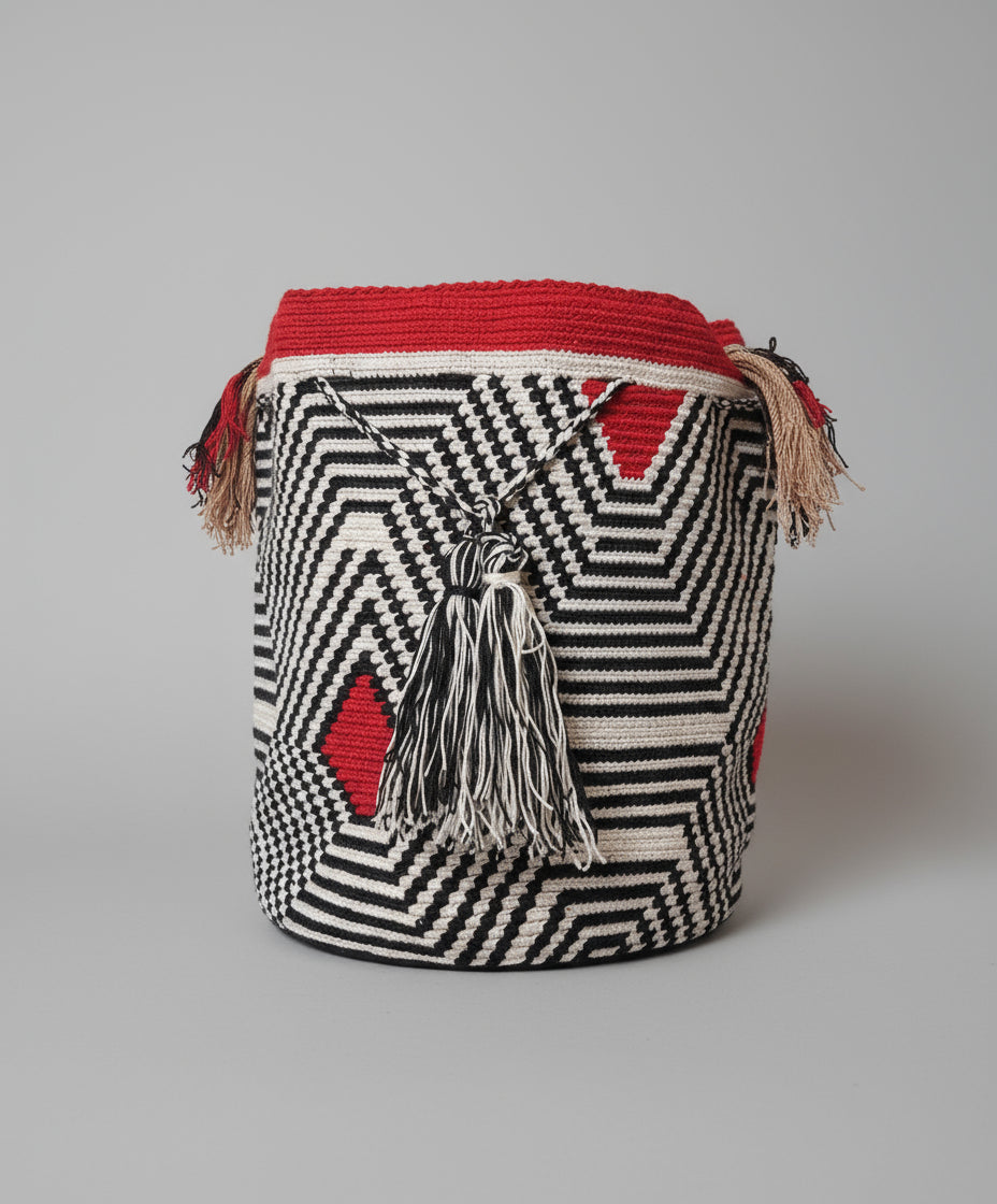 Authentic handmade Colombian Wayuu Mochila in vibrant red and black cotton threads with geometric design. Large artisanal bag ethically made, high-quality boho accessory.