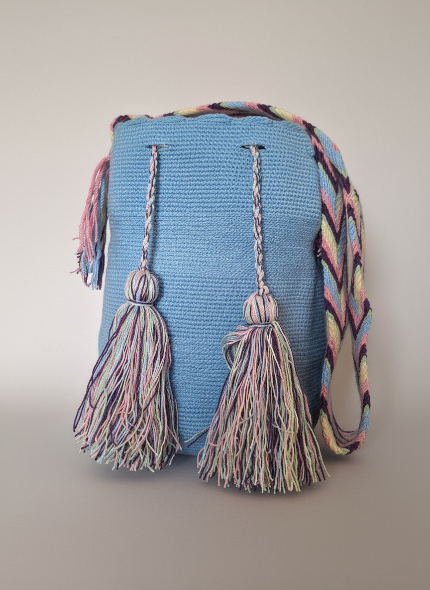 Authentic handmade Colombian Wayuu Mochila in sky blue. Lage bag is sustainably sourced and styled for boho summer days.