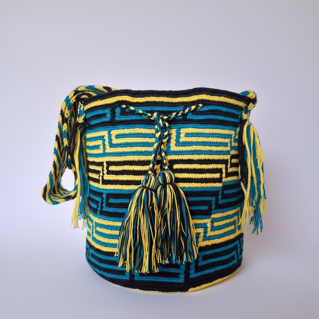 Authentic Colombian Wayuu Mochila in yellow black and blue cotton threads with labyrinth design. Handmade bag is hand-woven by artisans; great for boho-chic layers