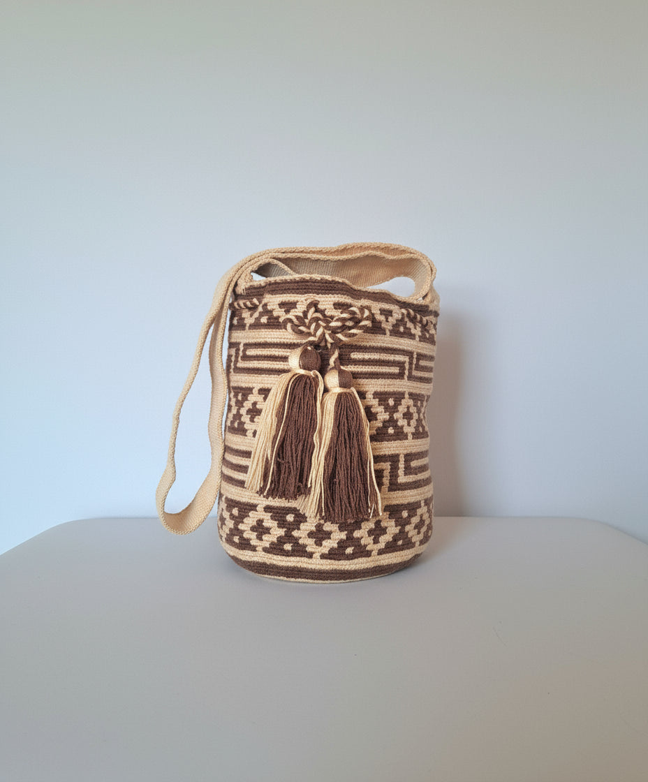 Authentic medium-sized handmade Colombian Wayuu Mochila with brown and beige and geometric pattern. Bag is responsibly hand-crafted; a boho festival essential.