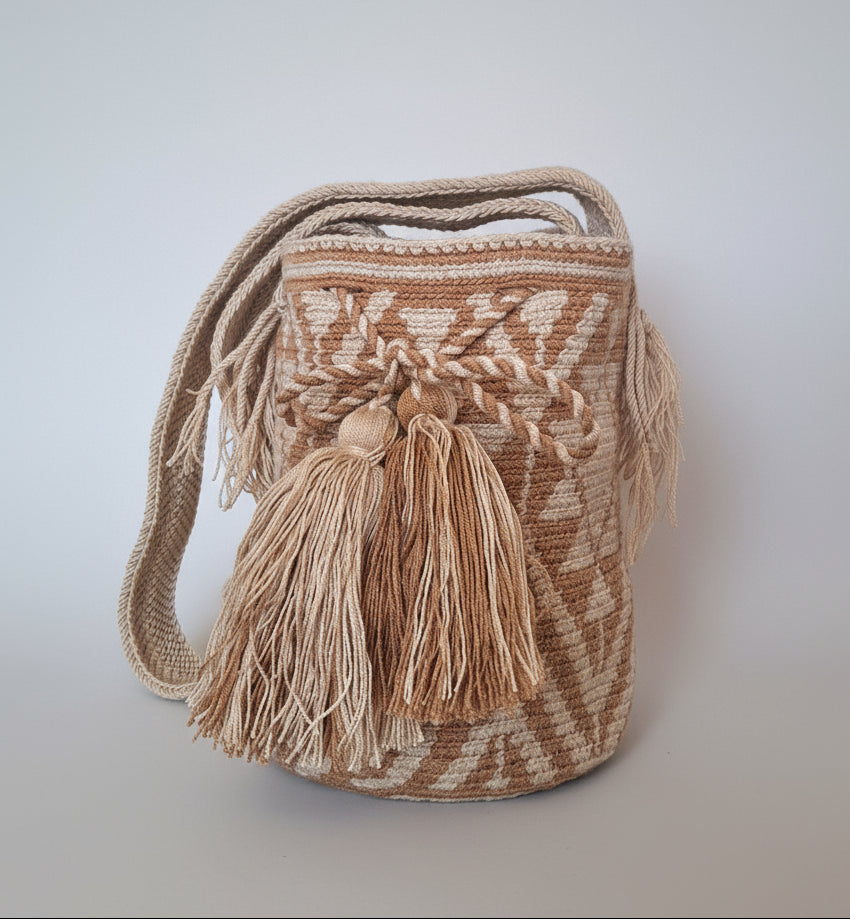 Authentic handmade Colombian Wayuu Mochila in vibrant cream and beige threads with solar design. Medium-sized bag is authentic Wayuu heritage, ideal for eclectic outfits.