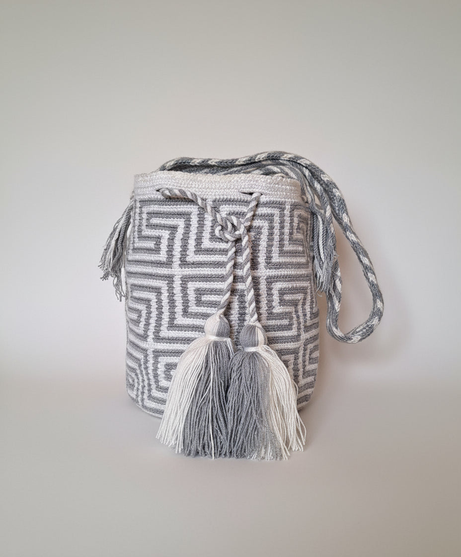 Authentic handmade Colombian Wayuu Mochila in grey and white cotton threads with labyrinth design. Large artisanal bag is ethically made, high-quality boho accessory. 