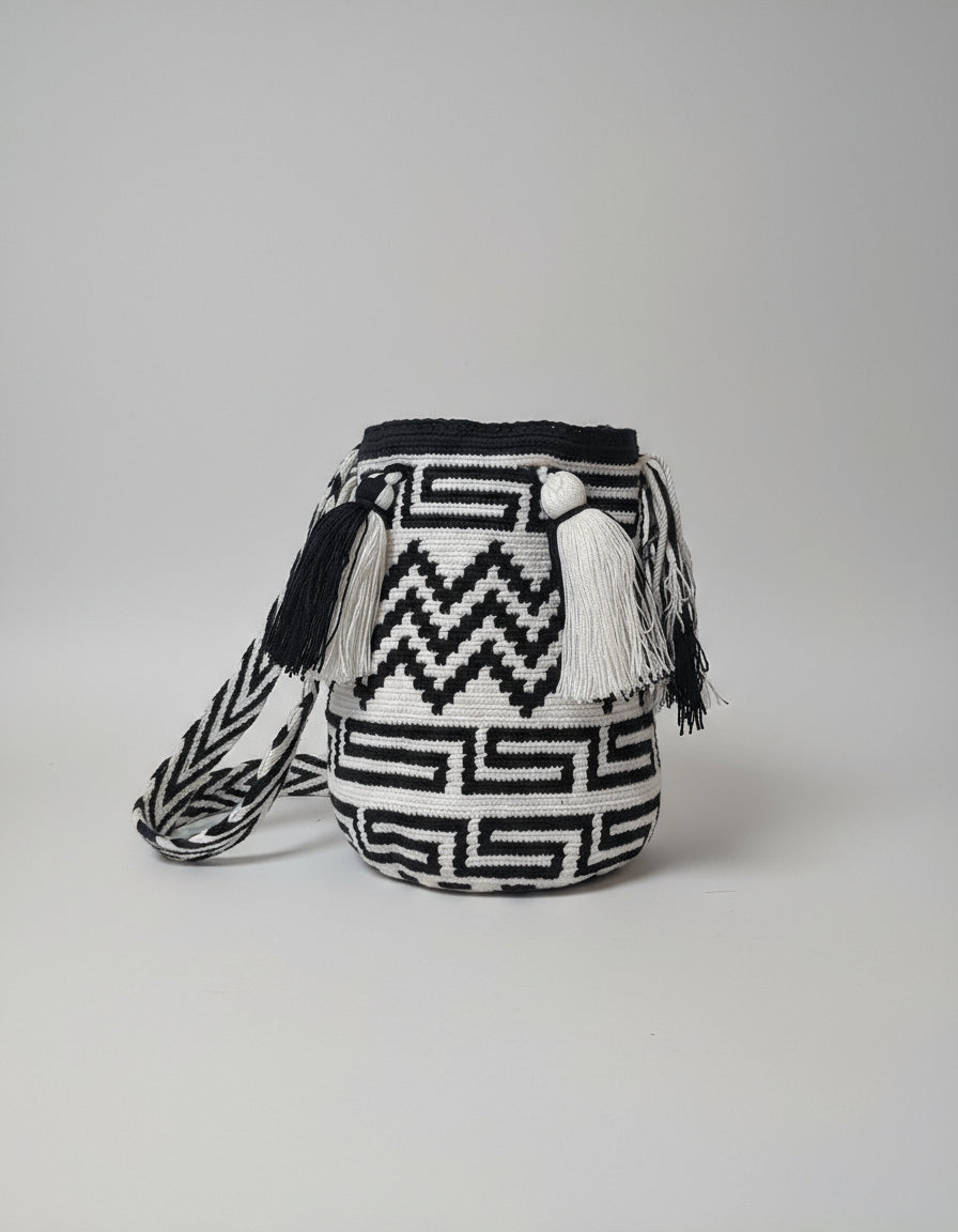 Medium sized authentic handmade Colombian Wayuu Mochila with Zigzag and Labyrinth Design in Black and White. Bag is authentic wayuu heritage, ideal for eclectic outfit.