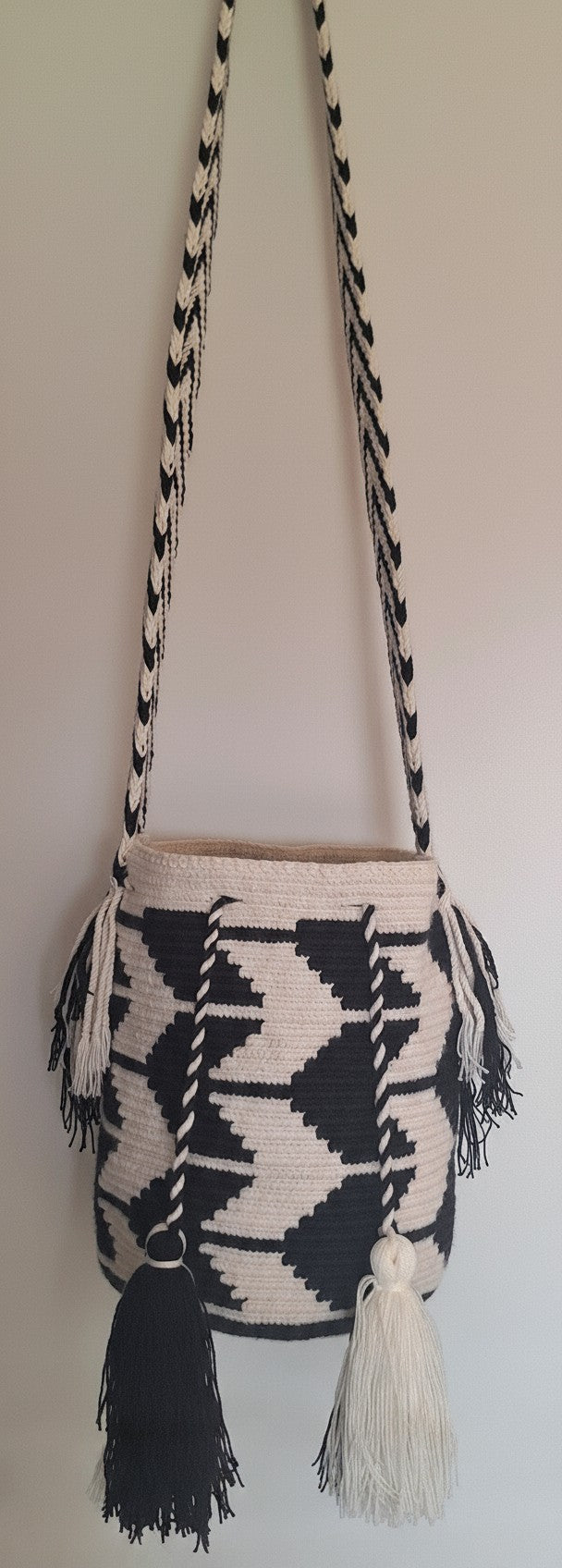 Authentic handmade Colombian Wayuu Mochila in black and white cotton threads, arrow design. Medium size with crossbody strap fully extended. Ethically and responsibly sourced.