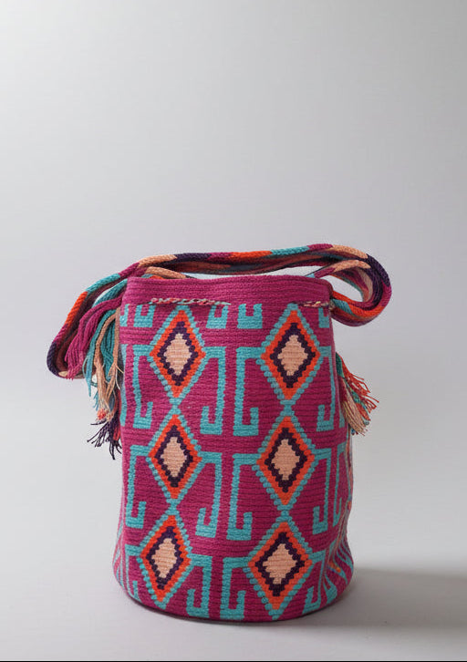 Detailed rear view of traditional Wayuu crochet technique and tassels on a mochila bag. Ethically and responsibly sourced.