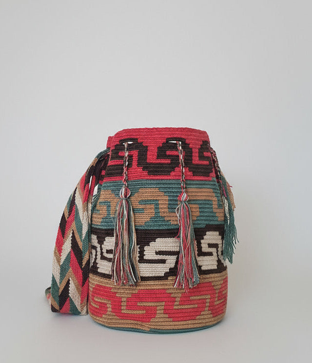 Authentic handmade Colombian Wayuu Mochila in vibrant cotton threads, and serpentine design symbol for wisdom. Ethically and responsibly sourced.