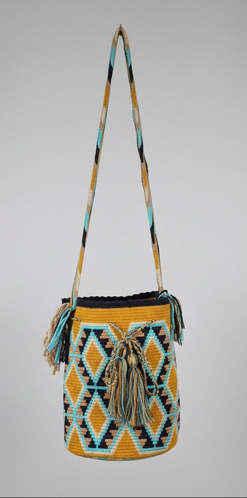 Authentic handmade Colombian Wayuu Mochila in vibrant tight woven cotton threads, geometric design. Crossbody strap fully extended. Ethically and responsibly sourced.
