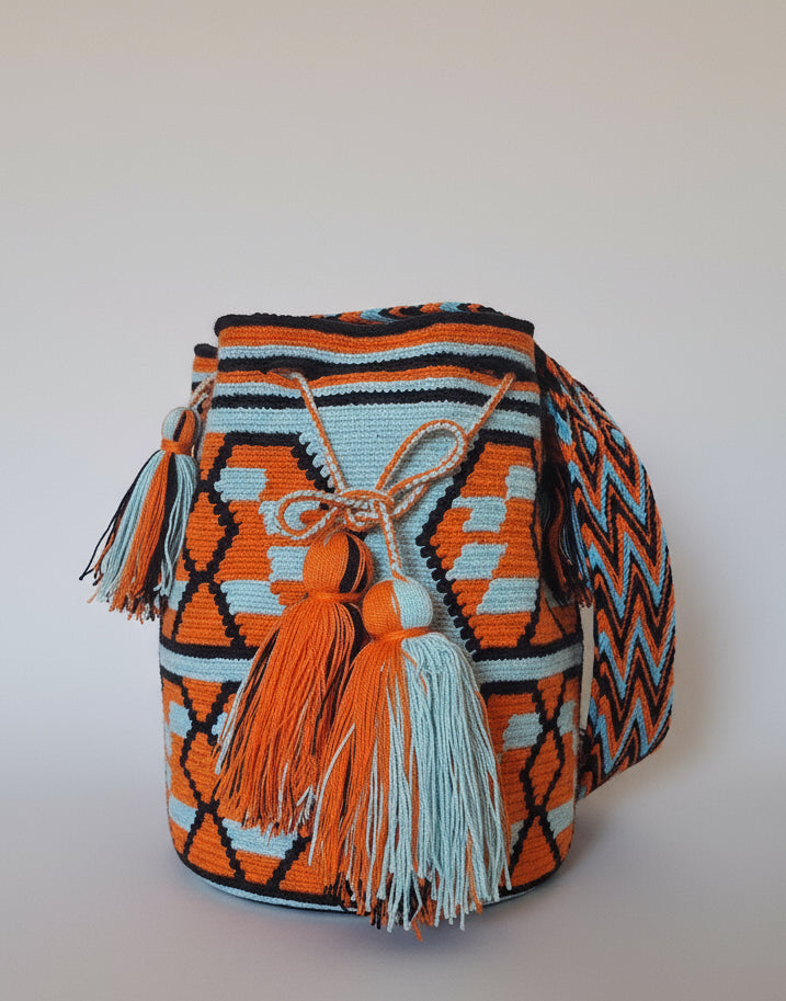 Authentic handmade Colombian Wayuu Mochila in vibrant cotton threads, geometric design. Ethically and responsibly sourced.