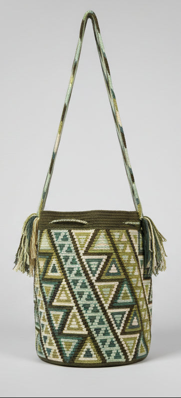 Detailed view of traditional Wayuu crochet technique and tassels on a mochila bag, with crossbody strap extended. Ethically and responsibly sourced.