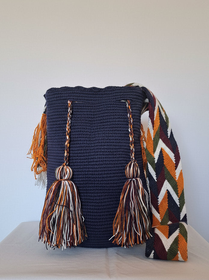 Detailed view of traditional Wayuu dark blue mochila bag. Ethically and responsibly sourced