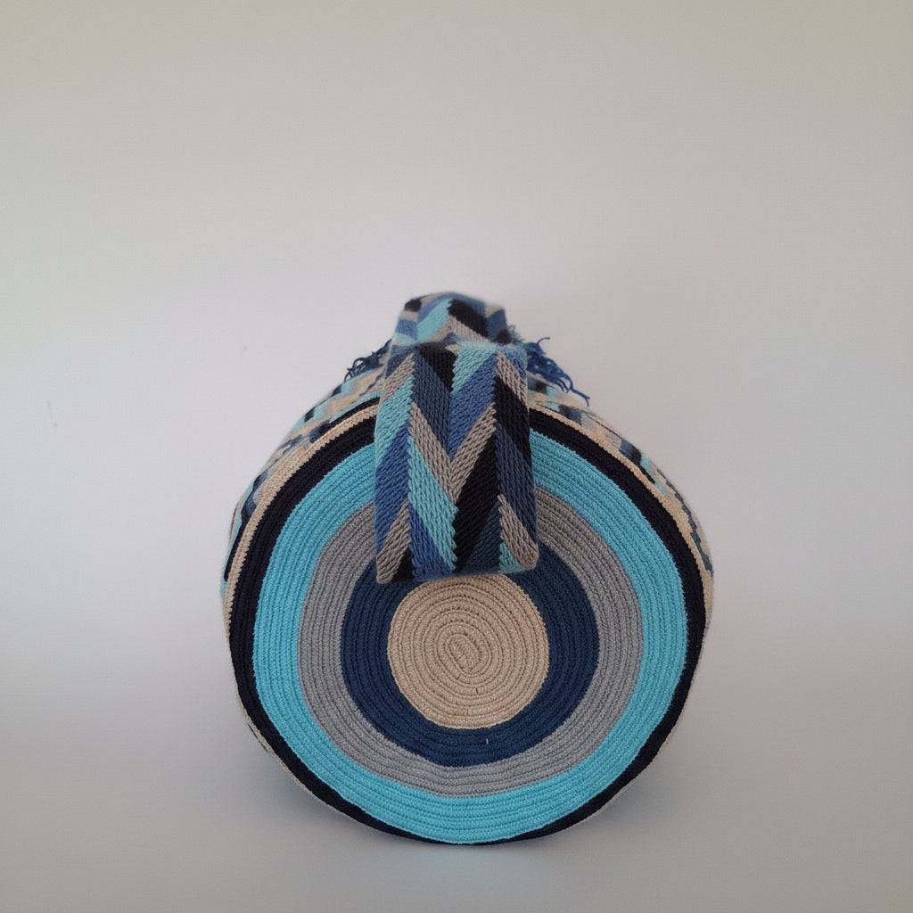 View of base of blue and white Wayuu mochila bag. Bought ethically in Colombia