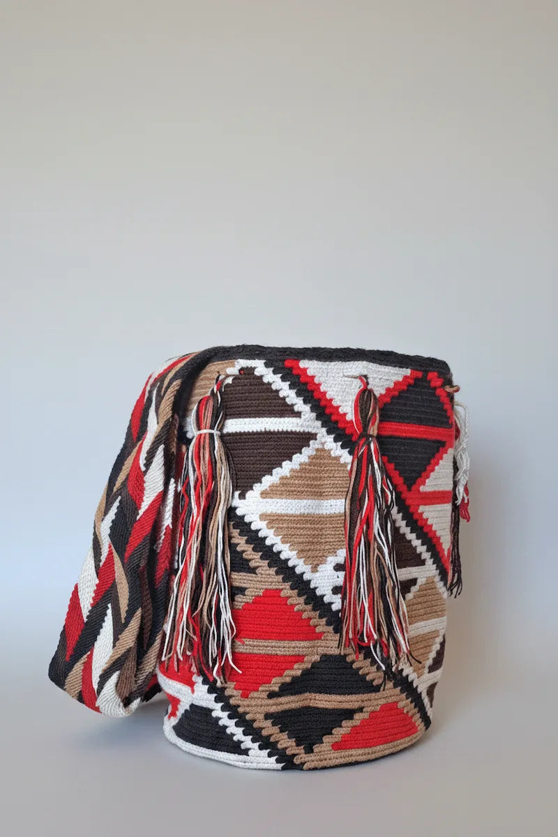 Authentic handmade Colombian Wayuu Mochila in brown, beige and red cotton threads, with geometric diamond design. Ethically and responsibly sourced.