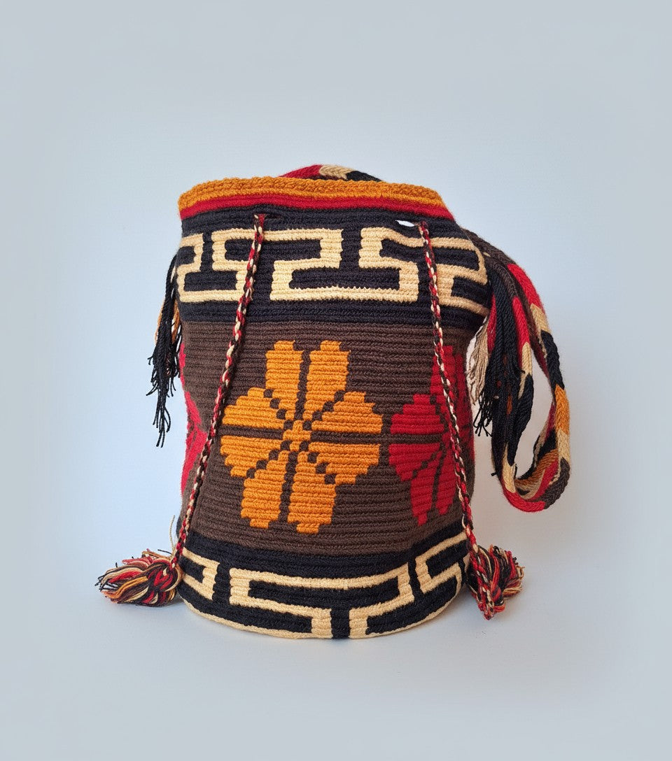 Authentic handmade Colombian Wayuu Mochila in brown, ochre and red cotton threads with four-petal design. Ethically and responsibly sourced.