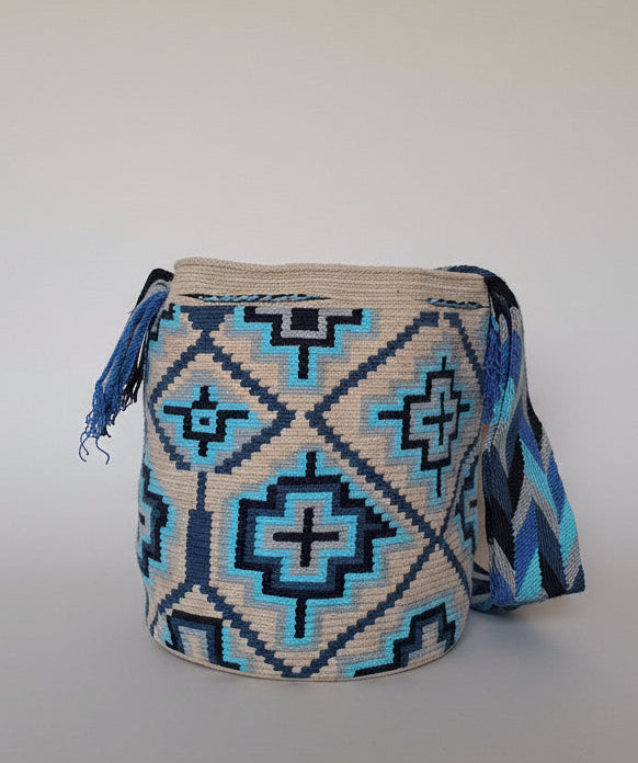 Detailed view of traditional Wayuu crochet technique and tassels on a mochila bag. Ethically and responsibly sourced.