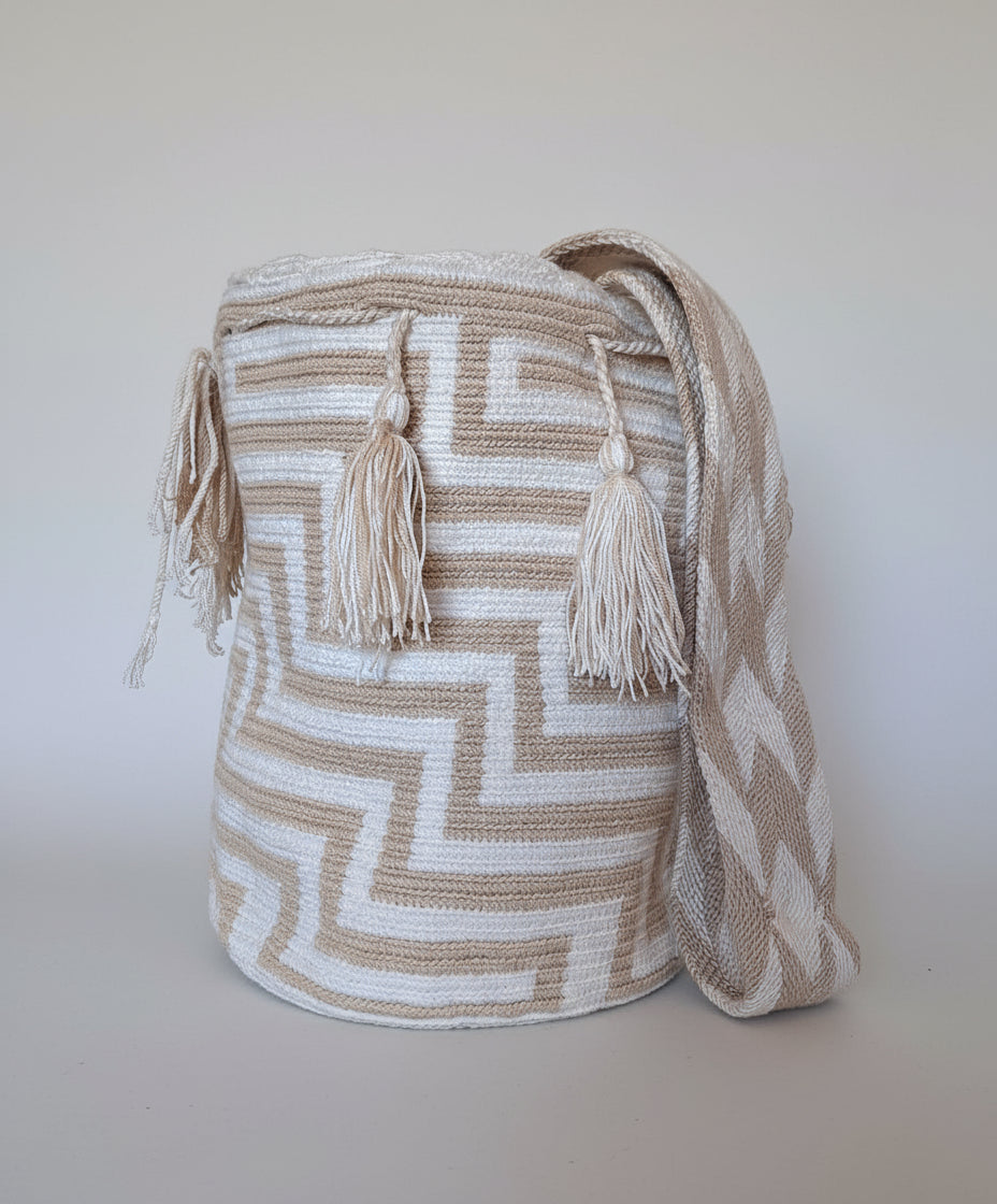 Authentic handmade Colombian Wayuu Mochila in soft-toned cotton threads, geometric design. Ethically and responsibly sourced.